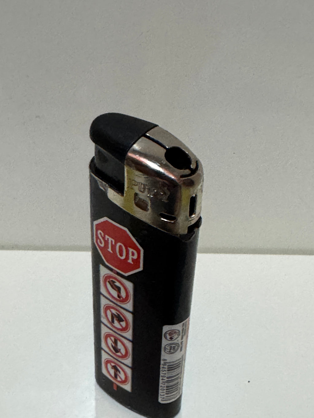 STOP road sign lighter – black graphic design