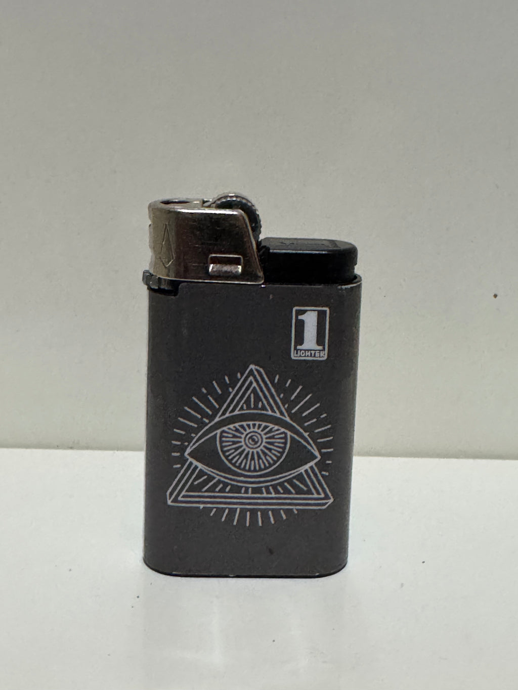 All-seeing eye pyramid lighter – black streetwear graphic
